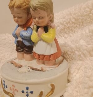 Adorable Ceramic Figurine with Praying Children